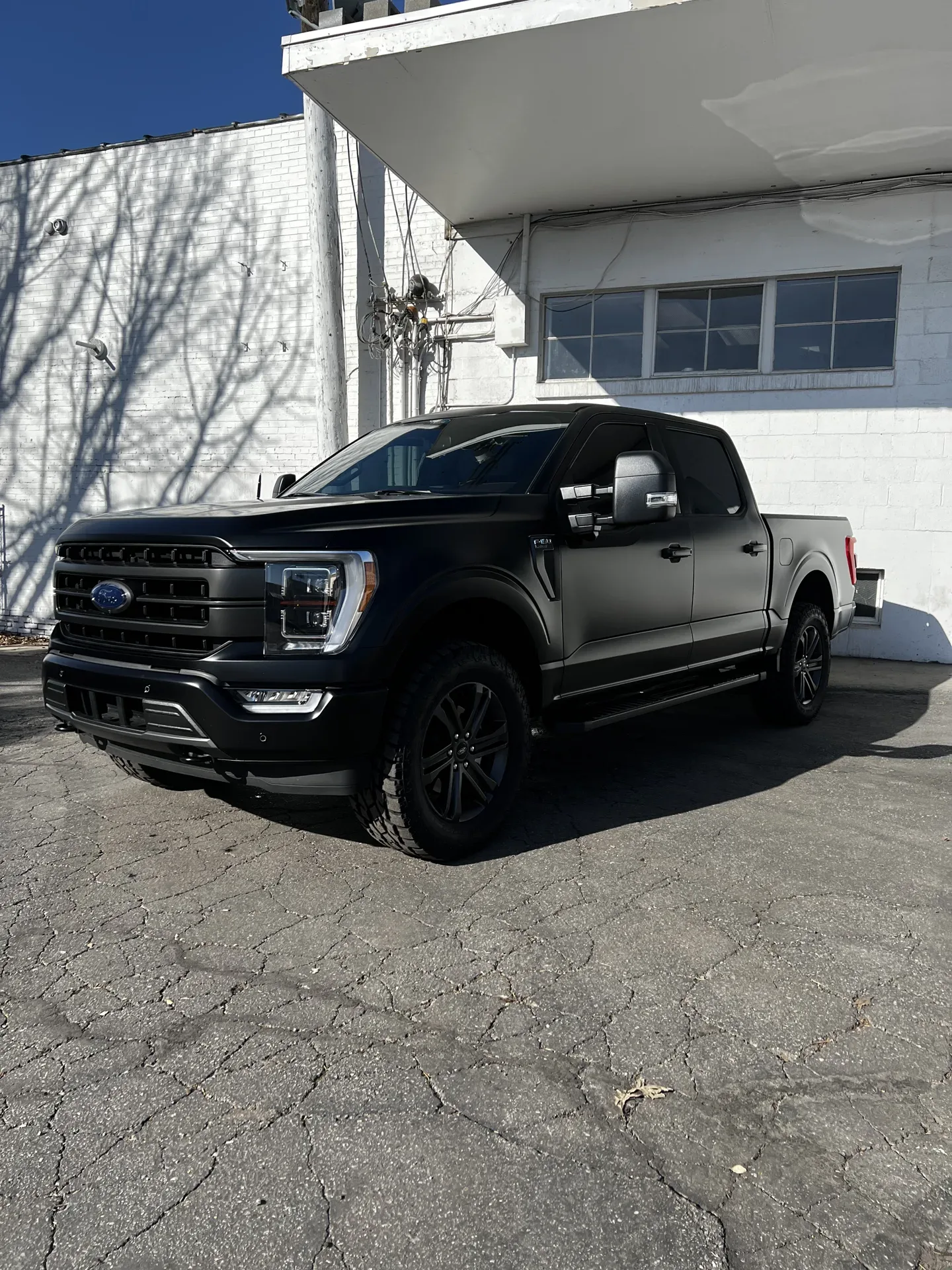 Black Ford F-150 truck with paint protection film at 4s Custom in Salt Lake City.