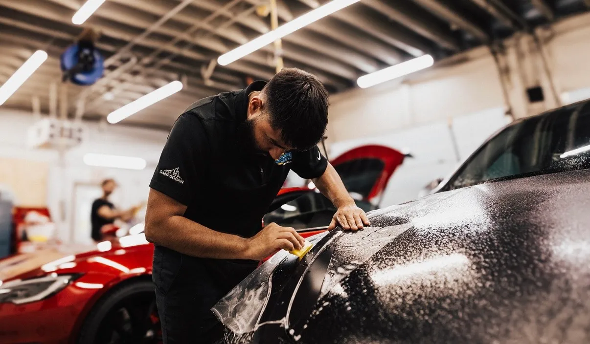 4s Custom technician installing STEK paint protection film in Salt Lake City